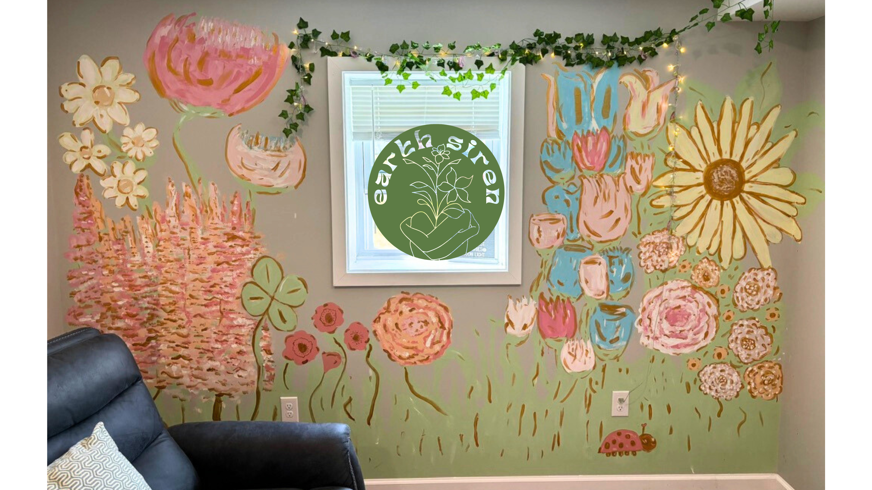 Wall mural of colorful oversized flowers painted by Elizabeth Schirk for The Earth Siren. Features textured florals in pink, gold, and green surrounding a window, bringing nature indoors